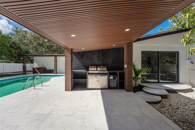 15201 SW 87th Ct, Palmetto Bay, FL 33157 - view of patio / terrace featuring a grill, a fenced in pool, fence, and exterior kitchen