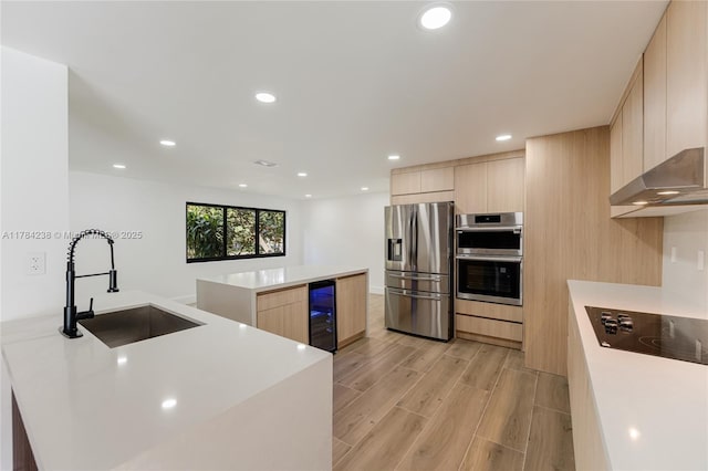 15201 SW 87th Ct, Palmetto Bay, FL 33157 - kitchen with modern cabinets, appliances with stainless steel finishes, a sink, wine cooler, and light brown cabinets