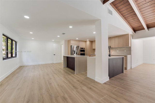 15201 SW 87th Ct, Palmetto Bay, FL 33157 - kitchen with light countertops, light brown cabinets, light wood-style flooring, and stainless steel refrigerator with ice dispenser