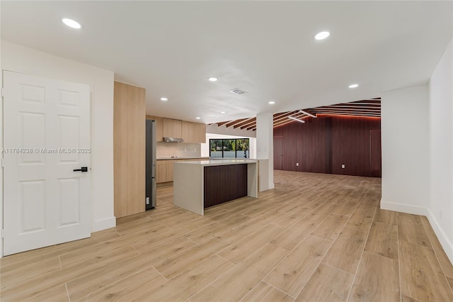 15201 SW 87th Ct, Palmetto Bay, FL 33157 - kitchen with freestanding refrigerator, light wood-type flooring, vaulted ceiling, light countertops, and open floor plan