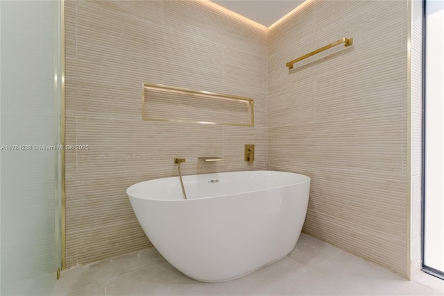 15201 SW 87th Ct, Palmetto Bay, FL 33157 - bathroom with a freestanding bath, tile patterned flooring, and tile walls