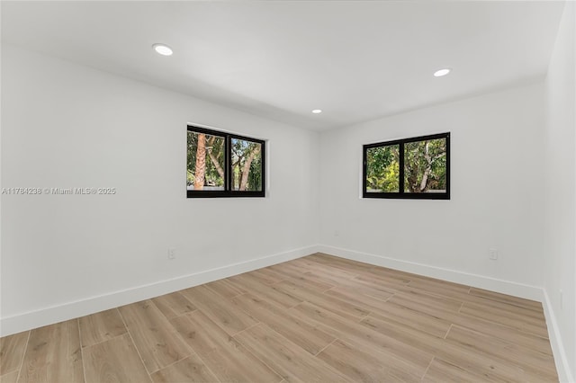 15201 SW 87th Ct, Palmetto Bay, FL 33157 - unfurnished room with light wood-style floors, baseboards, plenty of natural light, and recessed lighting