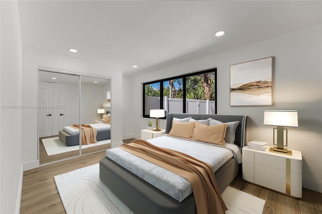 15201 SW 87th Ct, Palmetto Bay, FL 33157 - bedroom with a closet, baseboards, recessed lighting, and light wood-style floors