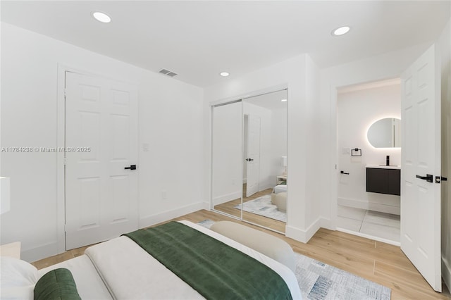 15201 SW 87th Ct, Palmetto Bay, FL 33157 - bedroom with a closet, light wood-type flooring, baseboards, recessed lighting, and visible vents