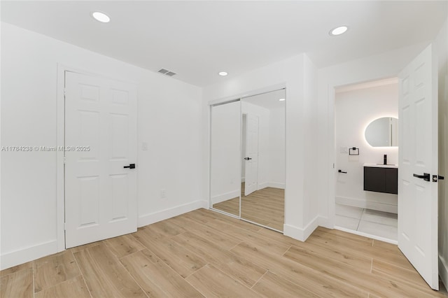 15201 SW 87th Ct, Palmetto Bay, FL 33157 - unfurnished bedroom featuring light wood-style floors, a closet, visible vents, and recessed lighting