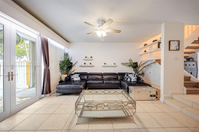 living room featuring stairs, a ceiling fan, and light tile patterned flooring