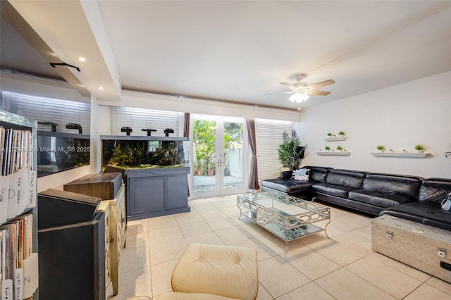living area featuring light tile patterned floors, a ceiling fan, and recessed lighting