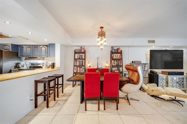 dining room featuring recessed lighting, a notable chandelier, light tile patterned floors, and visible vents
