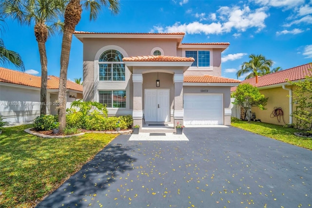 13473 NW 5th Ct, Plantation, FL 33325 - mediterranean / spanish home with a front yard, a tiled roof, an attached garage, stucco siding, and driveway