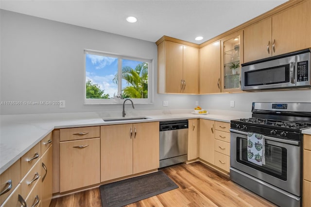 13473 NW 5th Ct, Plantation, FL 33325 - kitchen with stainless steel appliances, light countertops, light brown cabinets, and a sink