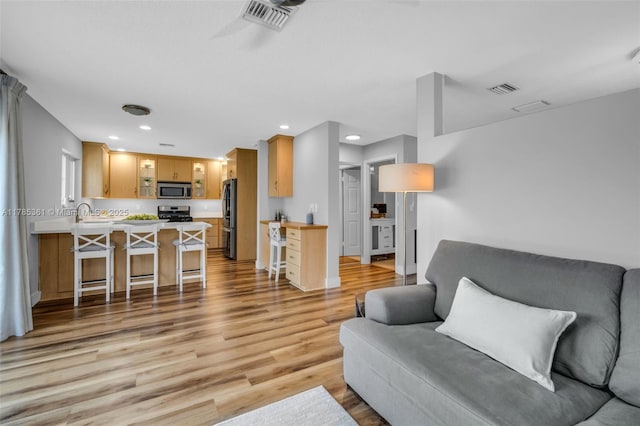 13473 NW 5th Ct, Plantation, FL 33325 - living room featuring visible vents, light wood-style flooring, and recessed lighting