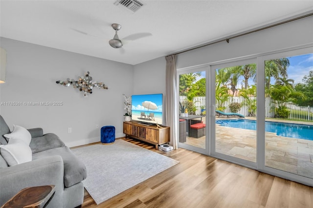 13473 NW 5th Ct, Plantation, FL 33325 - living area featuring wood finished floors, baseboards, a ceiling fan, and visible vents