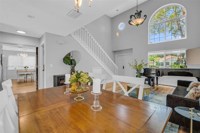 13473 NW 5th Ct, Plantation, FL 33325 - dining room featuring stairway, a high ceiling, and wood finished floors