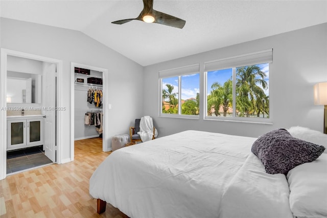 13473 NW 5th Ct, Plantation, FL 33325 - bedroom featuring a closet, a ceiling fan, a walk in closet, lofted ceiling, and wood finished floors