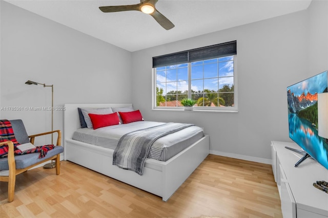 13473 NW 5th Ct, Plantation, FL 33325 - bedroom with light wood-style flooring, a ceiling fan, and baseboards