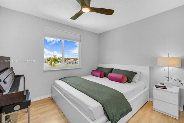 13473 NW 5th Ct, Plantation, FL 33325 - bedroom with light wood-style floors, baseboards, and a ceiling fan
