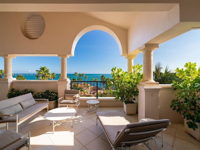 view of patio featuring outdoor lounge area and a water view