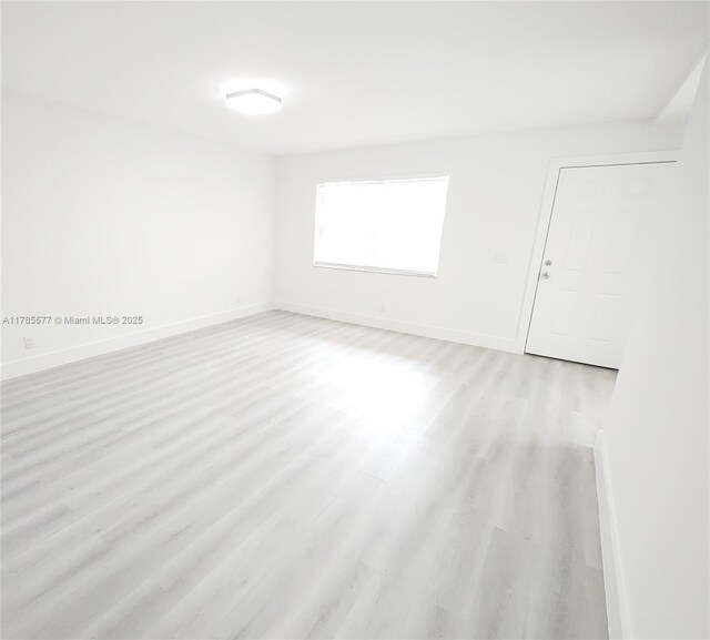 60 Burgundy B 60, Delray Beach, FL 33484 - empty room featuring light wood finished floors and baseboards