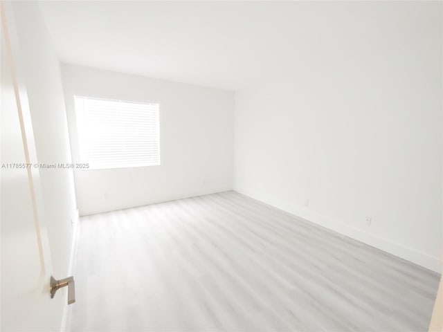 60 Burgundy B 60, Delray Beach, FL 33484 - spare room with wood finished floors