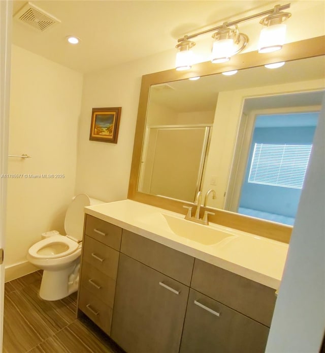 60 Burgundy B 60, Delray Beach, FL 33484 - full bathroom featuring visible vents, toilet, a shower stall, recessed lighting, and vanity