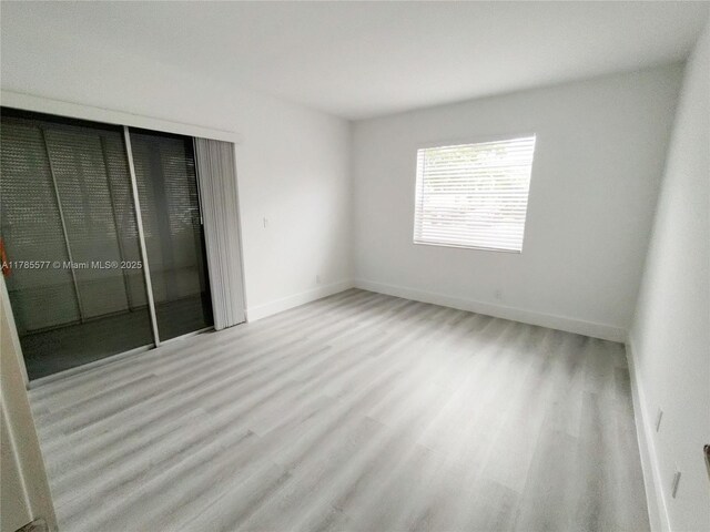 60 Burgundy B 60, Delray Beach, FL 33484 - interior space with baseboards and wood finished floors