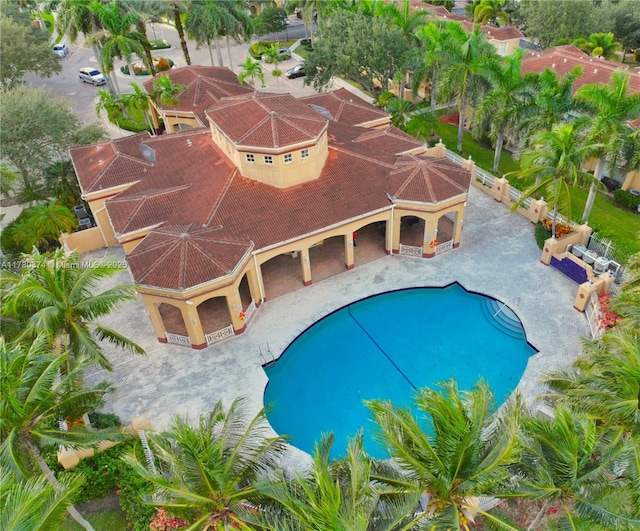 pool featuring a patio and a fenced backyard