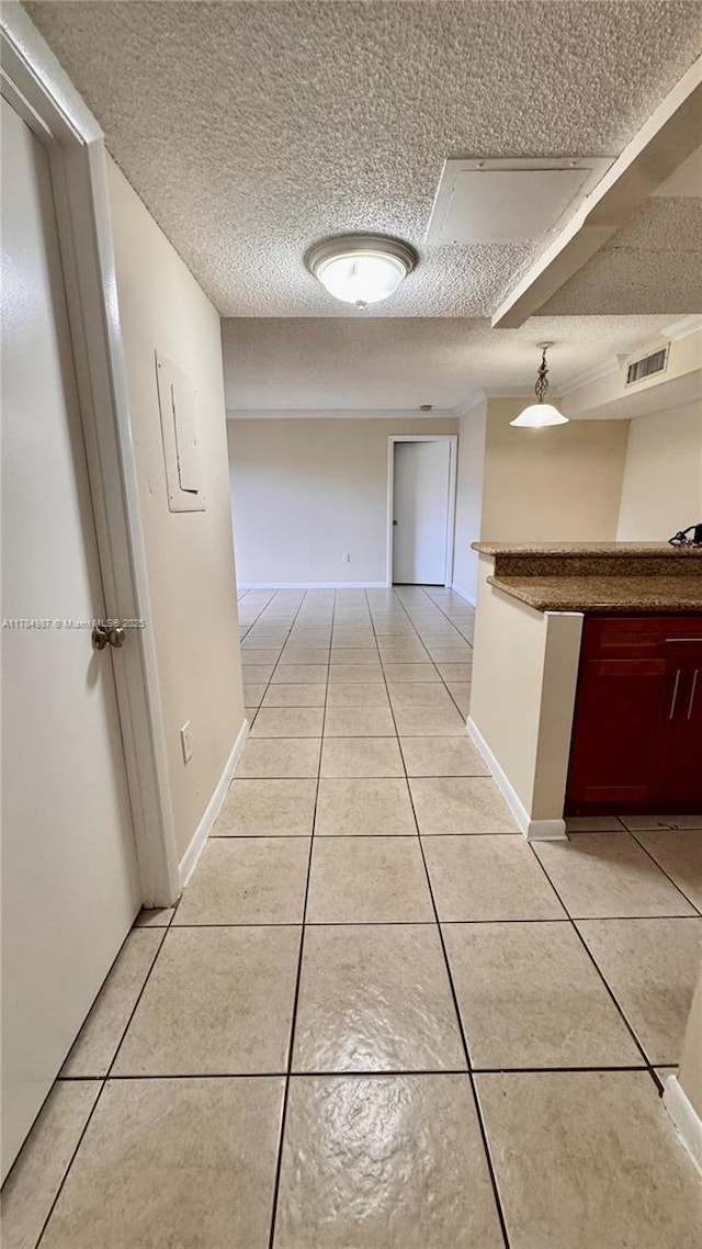 10795 SW 108th Ave Unit 103, Miami, FL 33176 - hall with a textured ceiling, light tile patterned flooring, baseboards, and visible vents