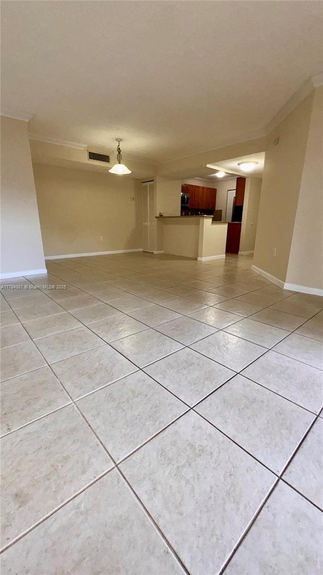 10795 SW 108th Ave Unit 103, Miami, FL 33176 - unfurnished living room featuring crown molding, light tile patterned floors, baseboards, and visible vents