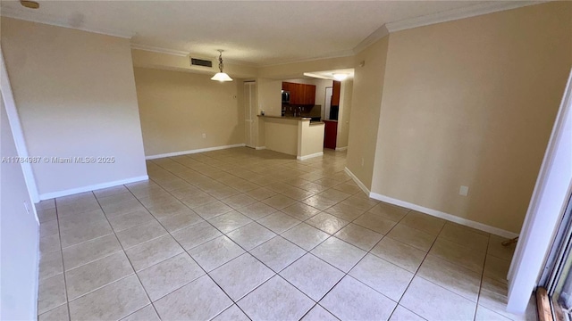 10795 SW 108th Ave Unit 103, Miami, FL 33176 - empty room with visible vents, baseboards, ornamental molding, and light tile patterned flooring