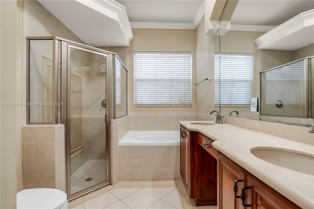bathroom featuring tile patterned floors, a shower stall, a garden tub, double vanity, and crown molding