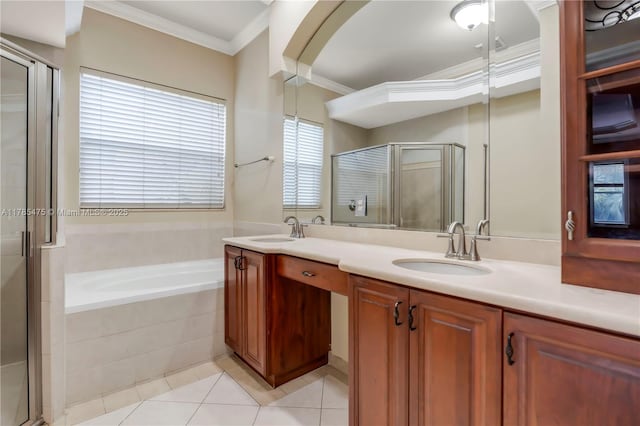 full bathroom featuring ornamental molding, a shower stall, tile patterned flooring, a garden tub, and double vanity