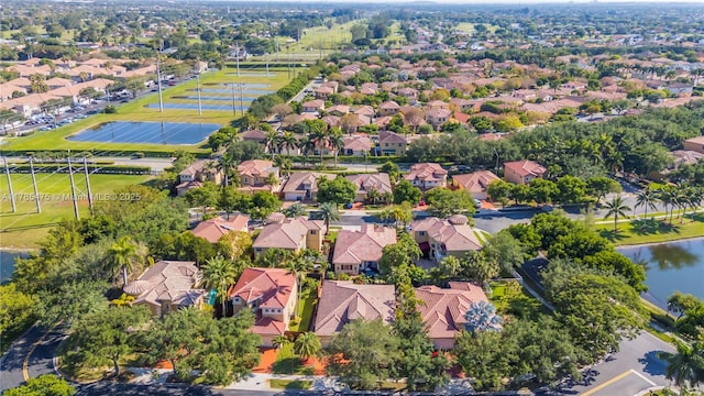 aerial perspective of suburban area with a nearby body of water