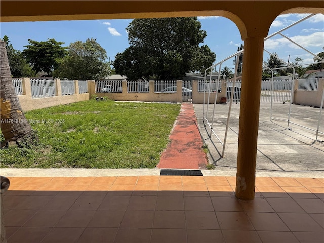 view of yard featuring a patio area and a fenced front yard