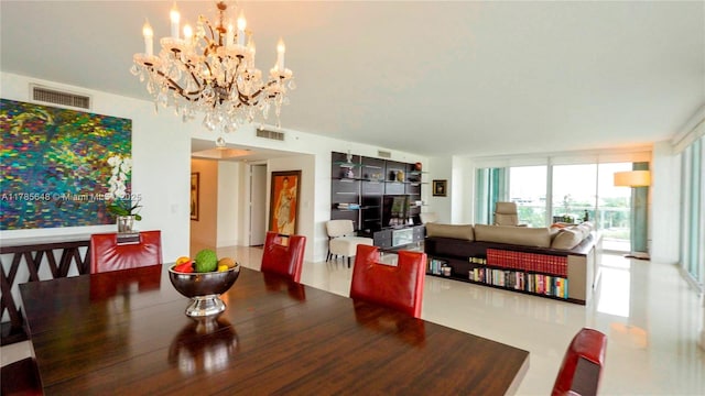 dining room featuring a wall of windows, visible vents, and a chandelier