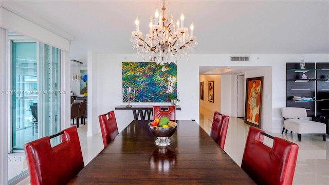 dining area featuring visible vents and a notable chandelier