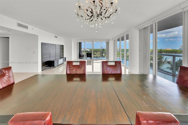 16500 Collins Ave Unit 656, Sunny Isles Beach, FL 33160 - dining room with expansive windows and a chandelier