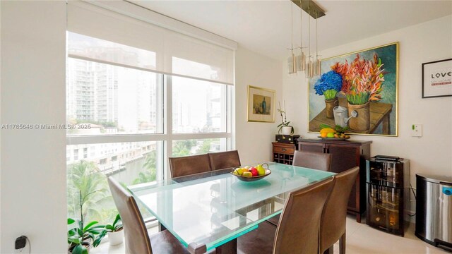 dining space featuring light tile patterned floors