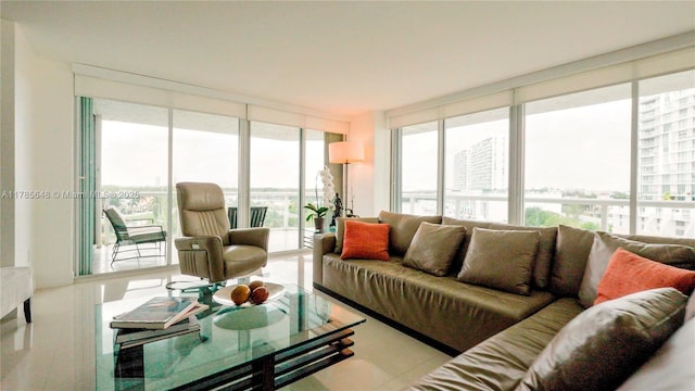 living area featuring expansive windows, a wealth of natural light, and a view of city
