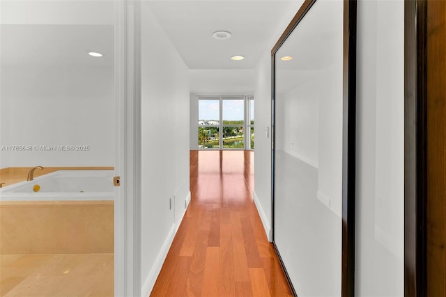 16500 Collins Ave Unit 656, Sunny Isles Beach, FL 33160 - hallway with light wood-type flooring and recessed lighting