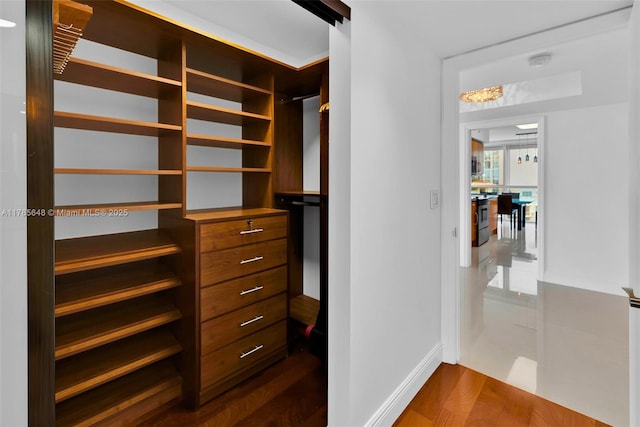 16500 Collins Ave Unit 656, Sunny Isles Beach, FL 33160 - spacious closet featuring dark wood-style floors