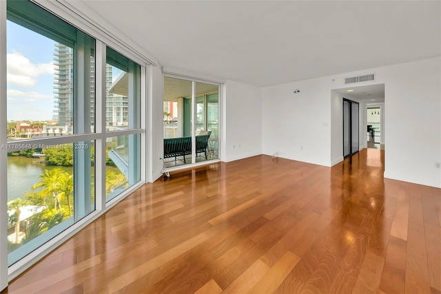 16500 Collins Ave Unit 656, Sunny Isles Beach, FL 33160 - empty room with wood finished floors and a water view