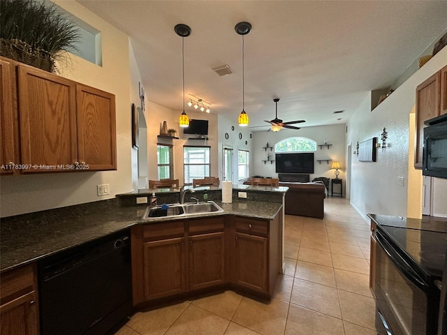 1214 SW Patricia Ave, Port St Lucie, FL 34953 - kitchen featuring black appliances, a sink, a peninsula, open floor plan, and pendant lighting
