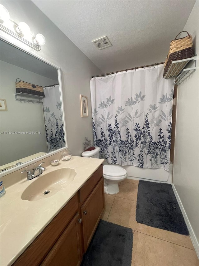 1214 SW Patricia Ave, Port St Lucie, FL 34953 - bathroom featuring vanity, tile patterned floors, a textured ceiling, toilet, and visible vents