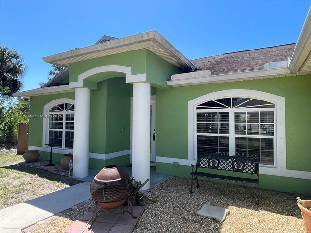 1214 SW Patricia Ave, Port St Lucie, FL 34953 - entrance to property with stucco siding