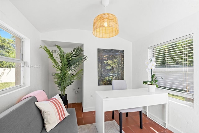 office with tile patterned flooring, lofted ceiling, and a wealth of natural light