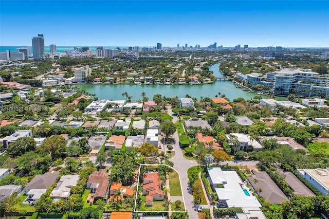 drone / aerial view with a view of city, a residential view, and a water view