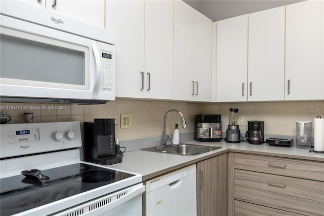 9660 S Belfort Cir Unit 207, Tamarac, FL 33321 - kitchen featuring white appliances, a sink, light countertops, backsplash, and white cabinetry