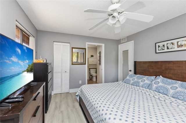 9660 S Belfort Cir Unit 207, Tamarac, FL 33321 - bedroom with light wood finished floors, a closet, a ceiling fan, baseboards, and ensuite bathroom