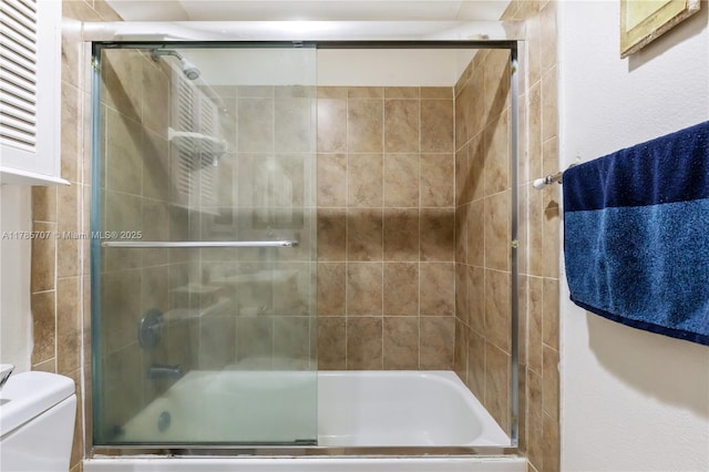9660 S Belfort Cir Unit 207, Tamarac, FL 33321 - full bathroom featuring combined bath / shower with glass door and toilet