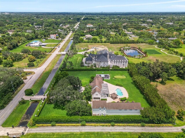 6320 Hancock Rd, Southwest Ranches, FL 33330 - tudor home with stucco siding, curved driveway, and a front lawn